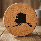 Alaska round cork coaster with the full state shape engraved