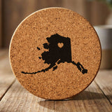 Alaska round cork coaster engraved with the state shape and a heart