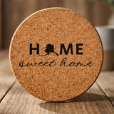 Alaska round cork coaster engraved with HOME sweet home using the state shape as the letter O