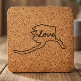 Alaska square cork coaster engraved with a hand-drawn state outline and love in cursive