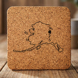 Alaska square cork coaster engraved with the state outline and home in script with a heart