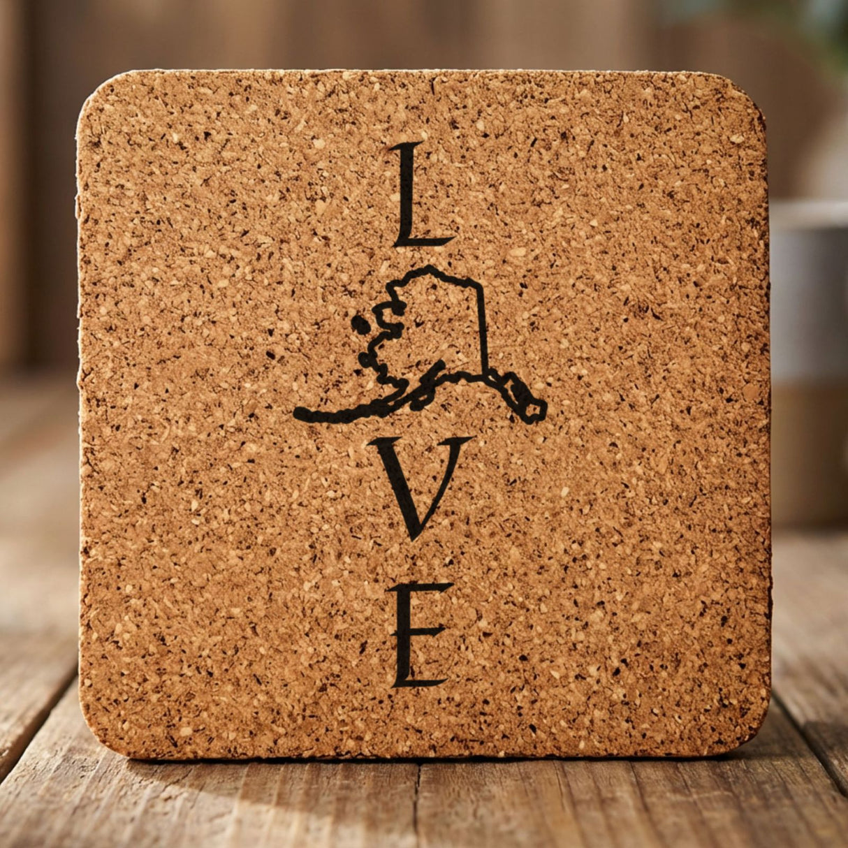 Alaska square cork coaster engraved with LOVE stacked vertically using the state as the letter O