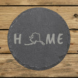 Alaska round slate coaster engraved with HOME using the state outline as the letter O