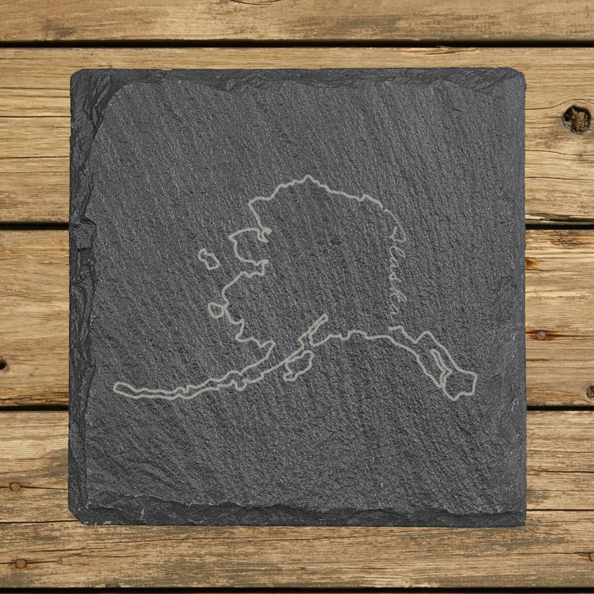 Alaska square slate coaster engraved with the state outline and Alaska in script lettering