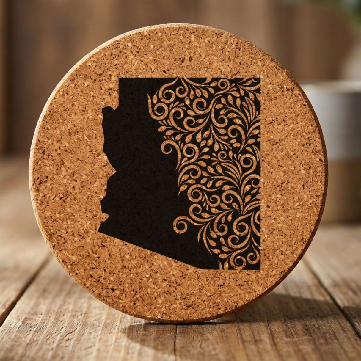 Arizona round cork coaster engraved with the state shape in ornate floral scrollwork