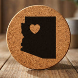 Arizona round cork coaster engraved with the state shape and a heart