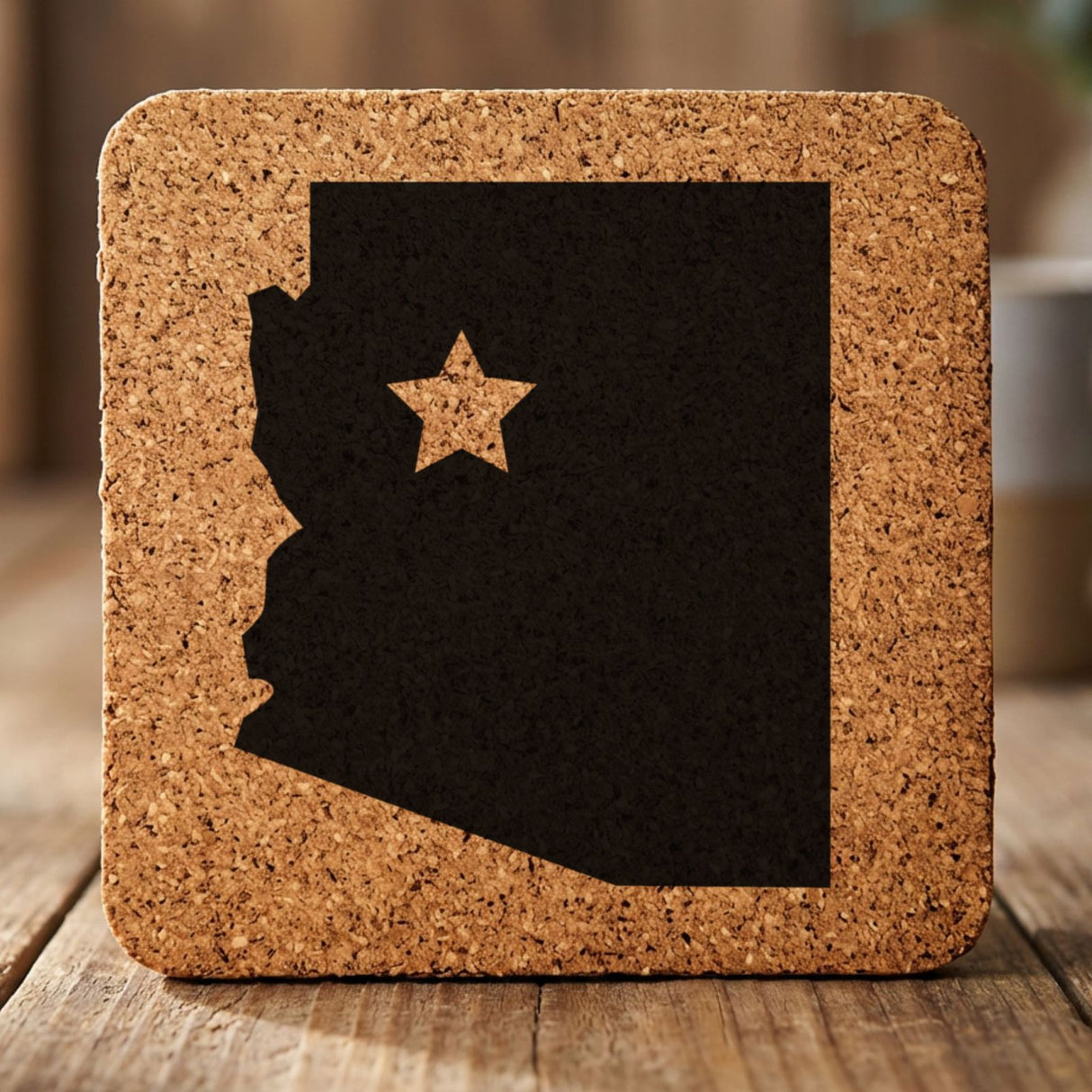 Arizona square cork coaster engraved with the state shape and a star