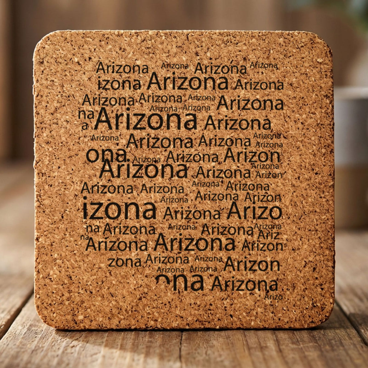 Arizona square cork coaster engraved with a word cloud of repeating Arizona text