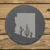 Arizona round slate coaster engraved with the state shape and saguaro cacti