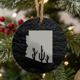 Arizona round slate Christmas ornament engraved with the state outline and a saguaro cactus