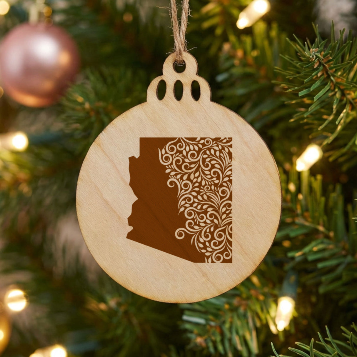 Arizona round wood Christmas ornament engraved with the state shape in ornate floral scrollwork