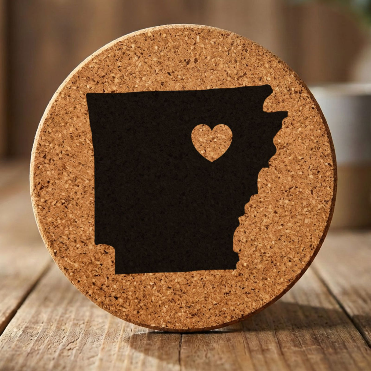 Arkansas round cork coaster engraved with the state shape and a heart