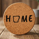 Arkansas round cork coaster engraved with HOME using the state outline as the letter O