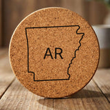 Arkansas round cork coaster engraved with the state outline and AR initials