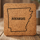 Arkansas square cork coaster engraved with the state outline and ARKANSAS in hand-drawn brush lettering