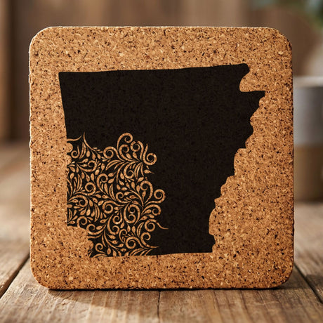 Arkansas square cork coaster engraved with the state shape in ornate floral scrollwork