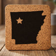 Arkansas square cork coaster engraved with the state shape and a star