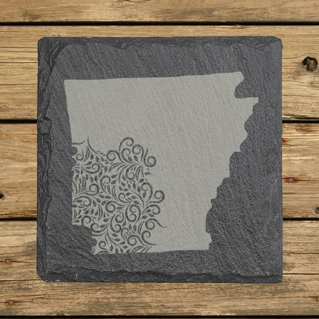 Arkansas square slate coaster engraved with the state shape in ornate floral scrollwork