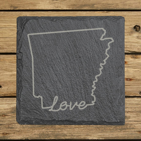 Arkansas square slate coaster engraved with a hand-drawn state outline and love in cursive