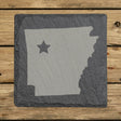 Arkansas square slate coaster engraved with the state shape and a star