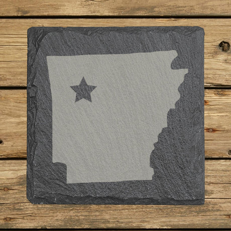 Arkansas square slate coaster engraved with the state shape and a star