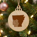 Arkansas round wood Christmas ornament engraved with the state shape in ornate floral scrollwork