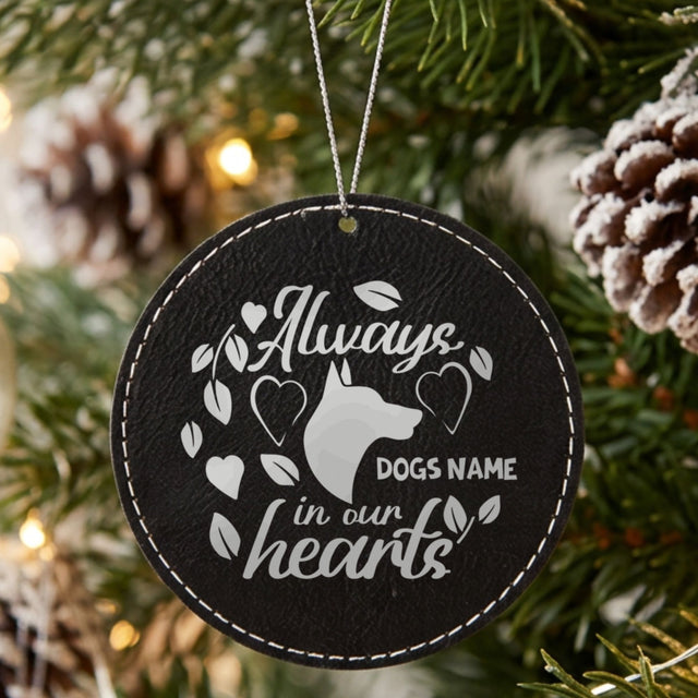 Black leatherette Christmas ornament engraved with the Always in Our Hearts dog design