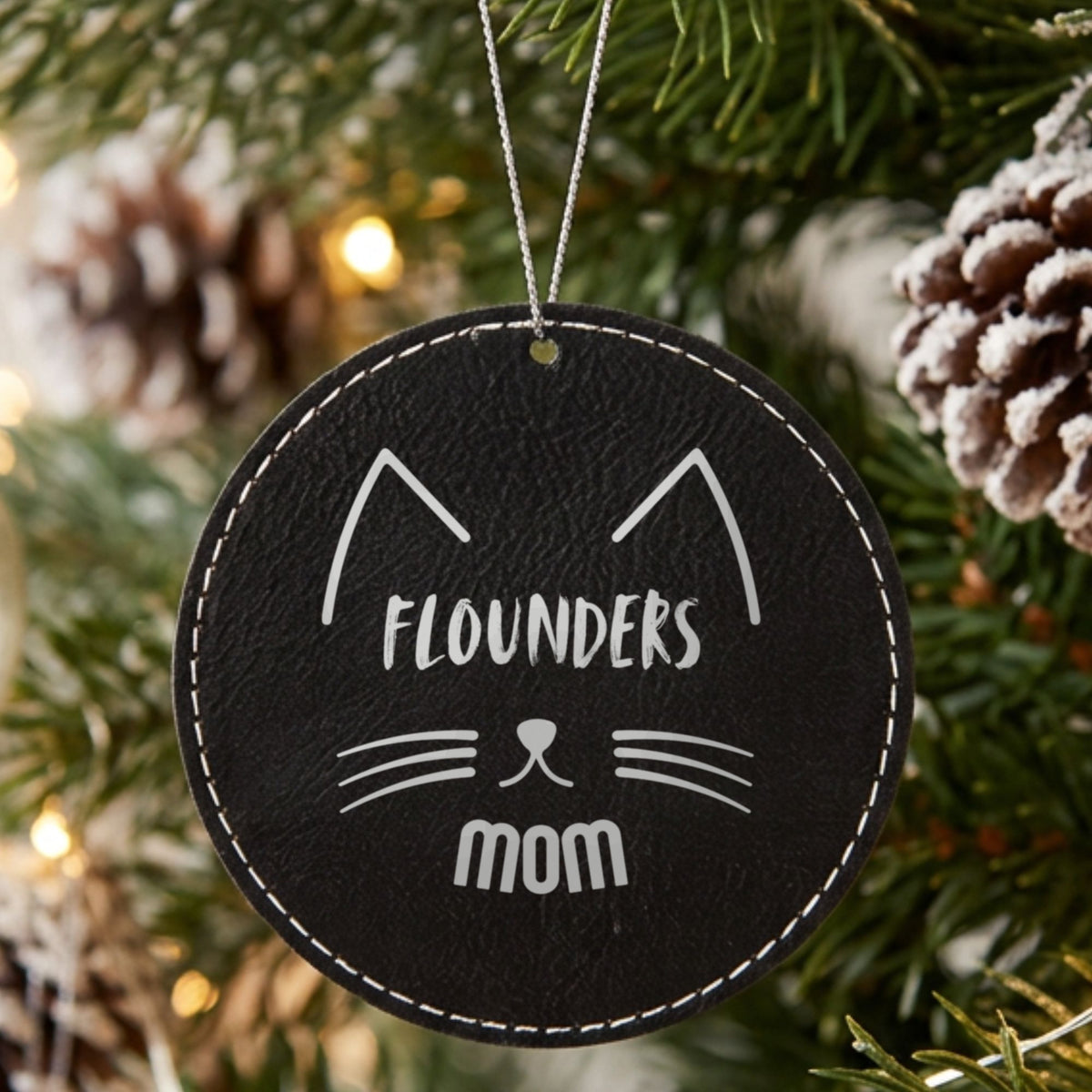 Black leatherette Christmas ornament engraved with the Cat Mom design and a sample pet name
