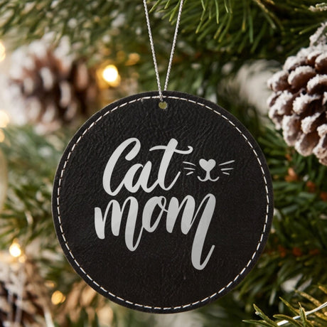 Black leatherette Christmas ornament engraved with Cat Mom, Whiskers design