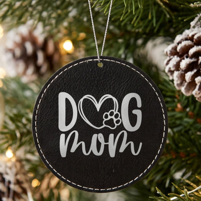 Black leatherette Christmas ornament engraved with a hand drawn Dog Mom heart and paw design