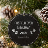 Black leatherette Christmas ornament engraved with the First Fur-Ever Christmas paw print design and a sample pet name