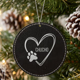Black leatherette Christmas ornament engraved with the heart and paw print design and a sample pet name