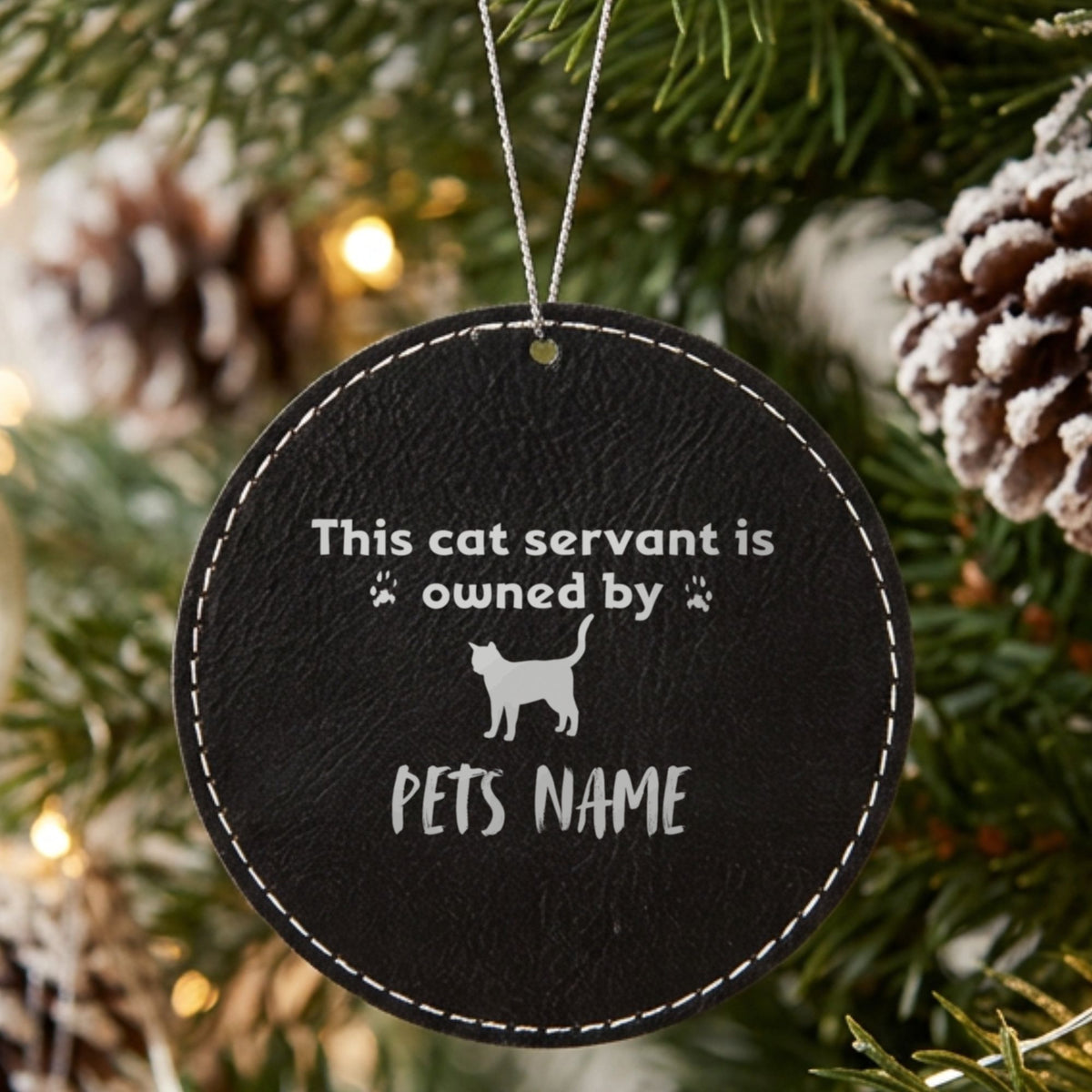 Black leatherette Christmas ornament engraved with the This Cat Servant is Owned By design