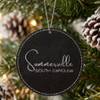 Black leatherette Christmas ornament laser engraved with the Script City and State design