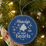 Blue leatherette Christmas ornament engraved with the Always in Our Hearts cat design and a sample pet name