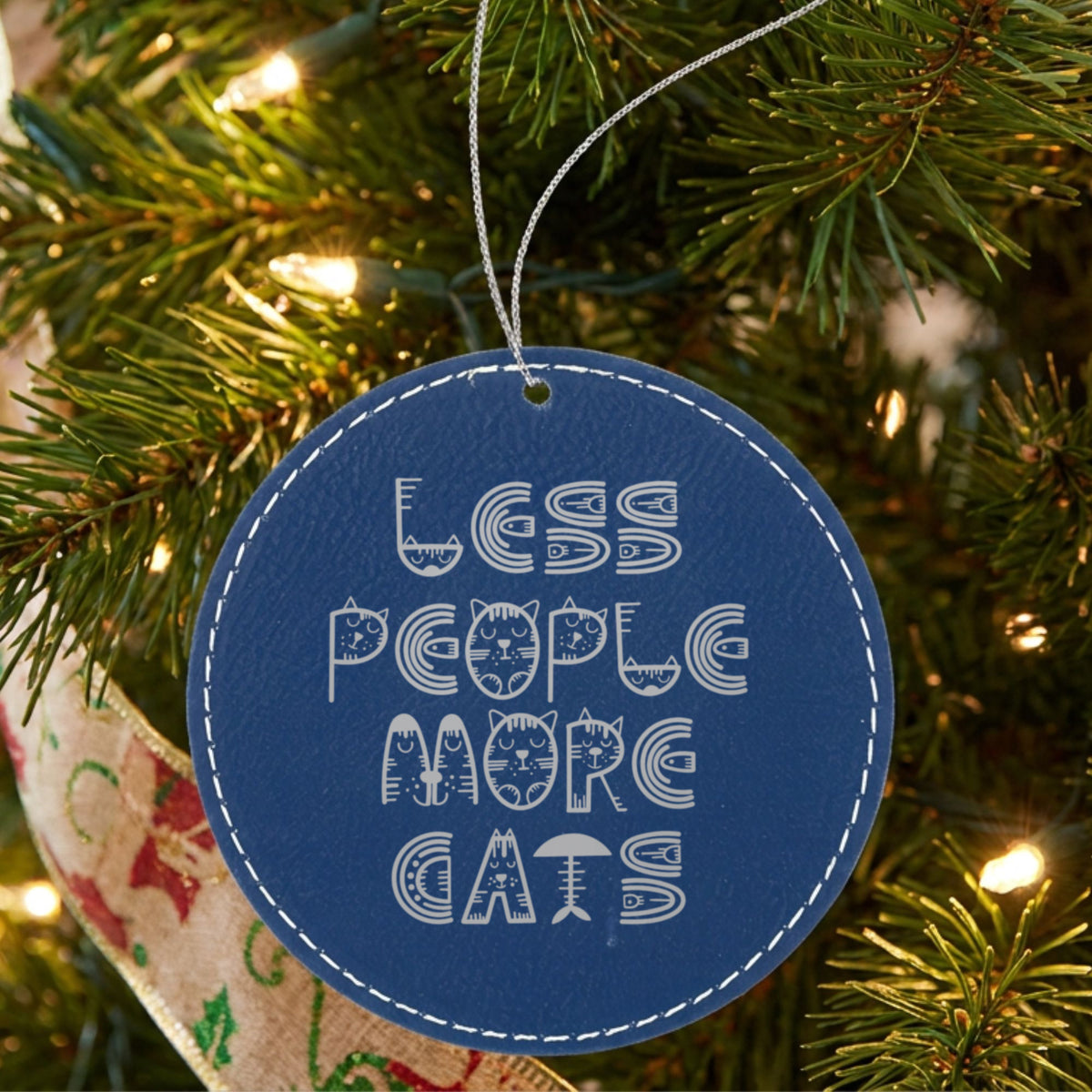 Blue leatherette Christmas ornament engraved with Less People, More Cats, Retro design