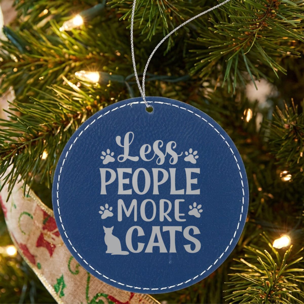 Blue leatherette Christmas ornament engraved with Less People, More Cats, Classic design