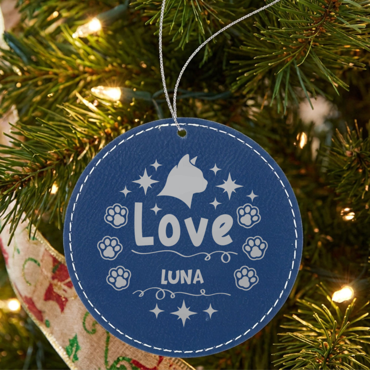 Blue leatherette Christmas ornament engraved with the Love cat design and a sample pet name