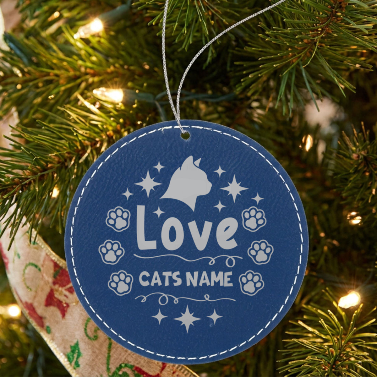 Blue leatherette Christmas ornament engraved with the Love cat design