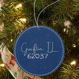 Blue leatherette Christmas ornament laser engraved with the Script City zip code design