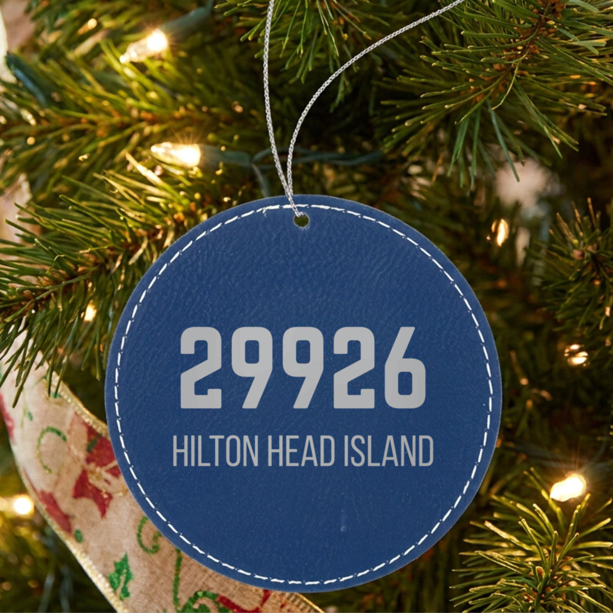 Blue leatherette Christmas ornament laser engraved with the Bold Zip zip code design