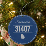 Blue leatherette Christmas ornament laser engraved with the City and State Outline zip code design