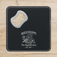 Black leatherette bottle opener coaster laser engraved with a Mississippi design of a mockingbird and magnolia blossoms