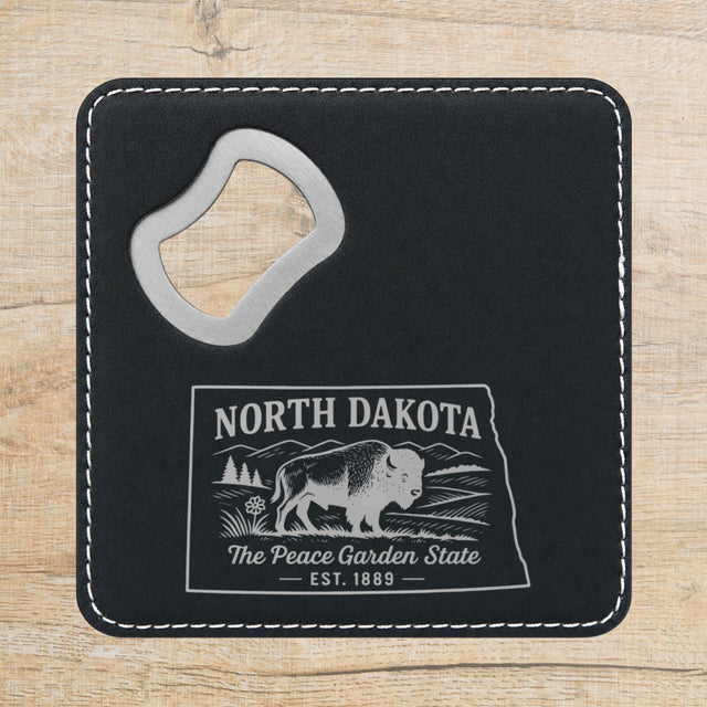 Black leatherette bottle opener coaster laser engraved with a North Dakota design of a bison on the plains