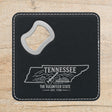 Black leatherette bottle opener coaster laser engraved with a Tennessee design of a guitar, a riverboat and the Smoky Mountains