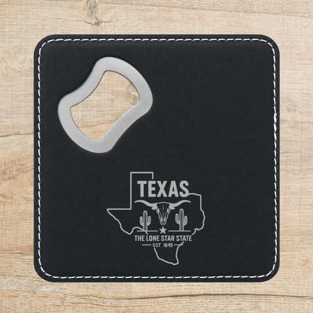 Black leatherette bottle opener coaster laser engraved with a Texas design of a longhorn skull, cactus and a lone star