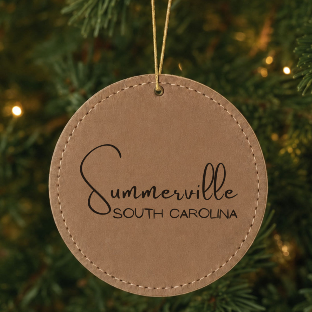 Brown leatherette Christmas ornament laser engraved with the Script City and State design