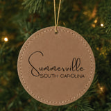 Brown leatherette Christmas ornament laser engraved with the Script City and State design