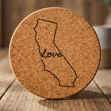 California round cork coaster engraved with a hand-drawn state outline and love in cursive