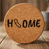 California round cork coaster engraved with HOME using the state outline as the letter O